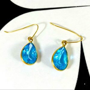 Stunning turquoise teardrop cubic zirconia stones set in gold-tone earrings
